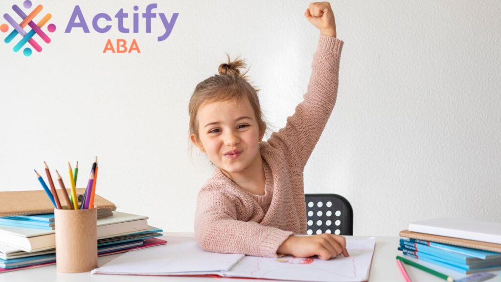 Speech goals for autism: a young girl raises her arm in triumph after successfully completing an assessment.
