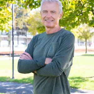 positive-mature-man-with-crossed